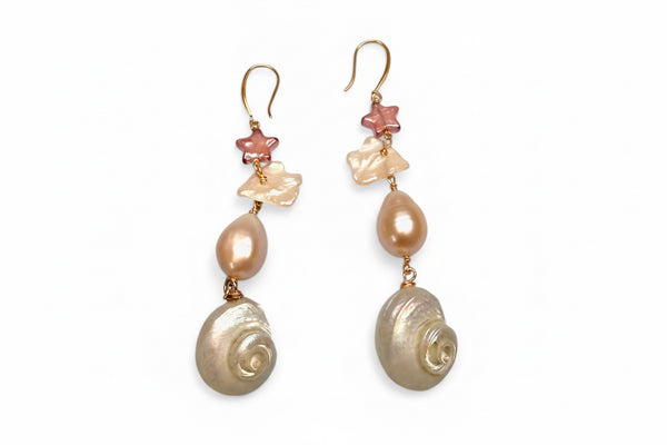 Pair of earrings with shell and starfish designs on a white background