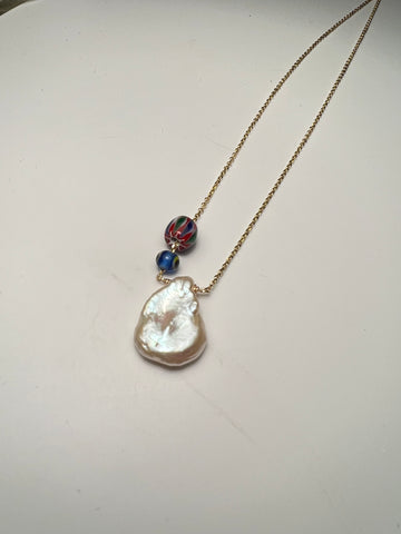Small single pearl with glass