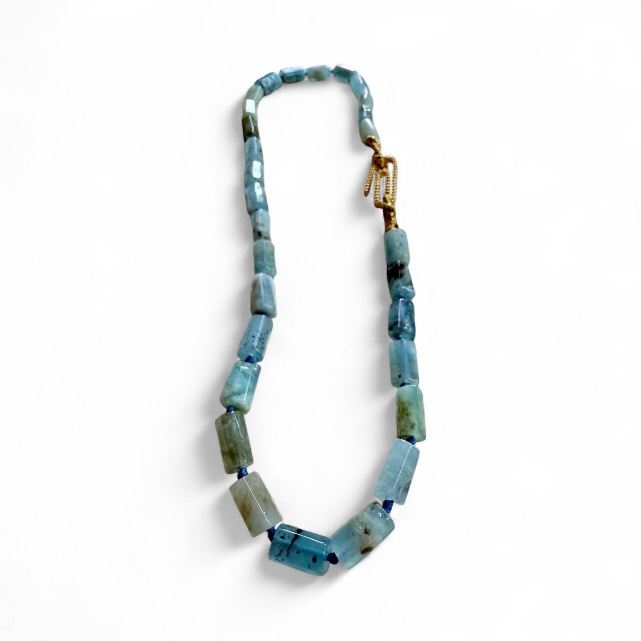 Necklace with blue Aquamarine tube shape stones on a white background inamullumani 