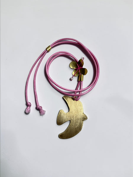 Handmade brass dove necklace with Petal Pink braided cord and pearl flower detail