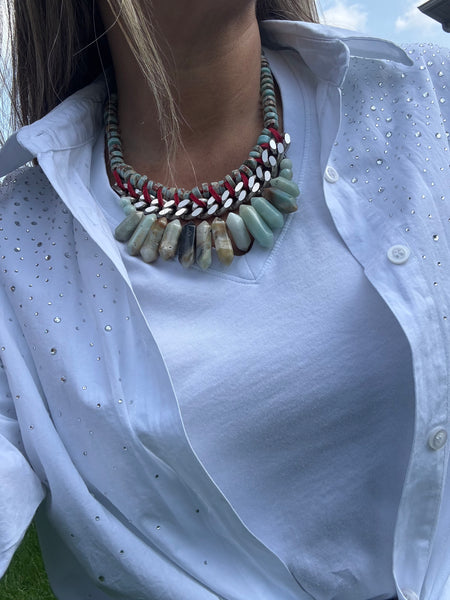 Close-up of a person wearing Statement chunky Amazonite  with a white shirt in the background. Inamullumani Lumani Oakville 