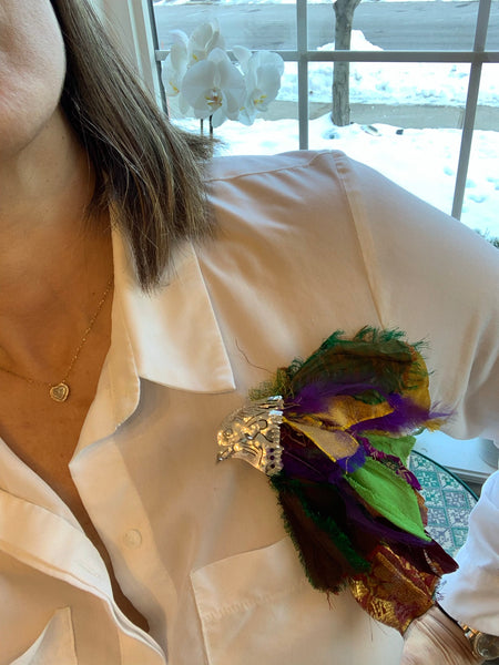 Handmade sterling silver bird brooch with upcycled material on white shirt