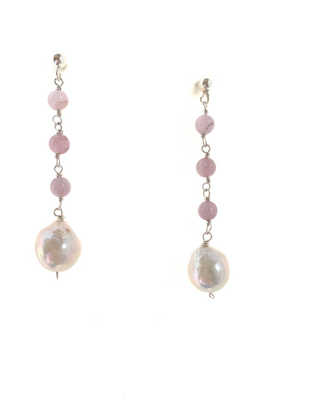 White baroque pearl and kunzite earrings on Whats background 