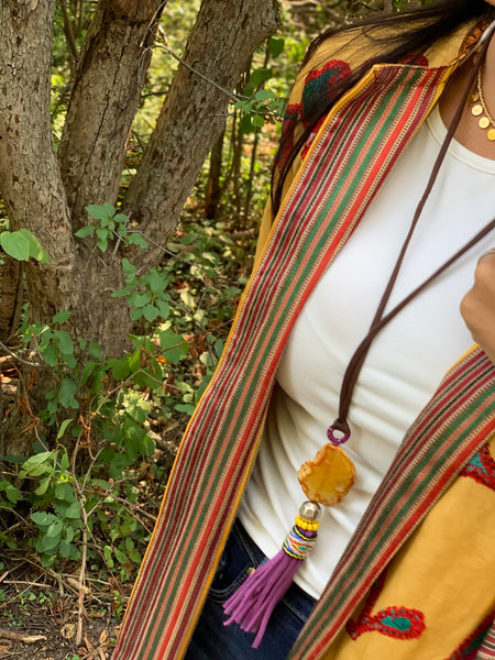 Long adjustable necklace with multimedia yellow stone and purple tassel 