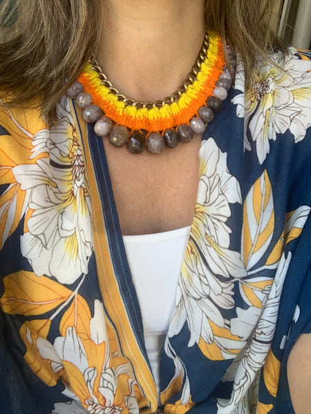 Woman wearing a statement crochet necklace 